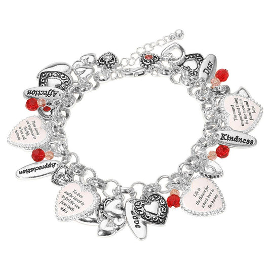 Silver-tone charm bracelet with heart-shaped pendants engraved with inspirational quotes, accented by red and clear beads; also available in gold-tone; 8" length with 2" extender.