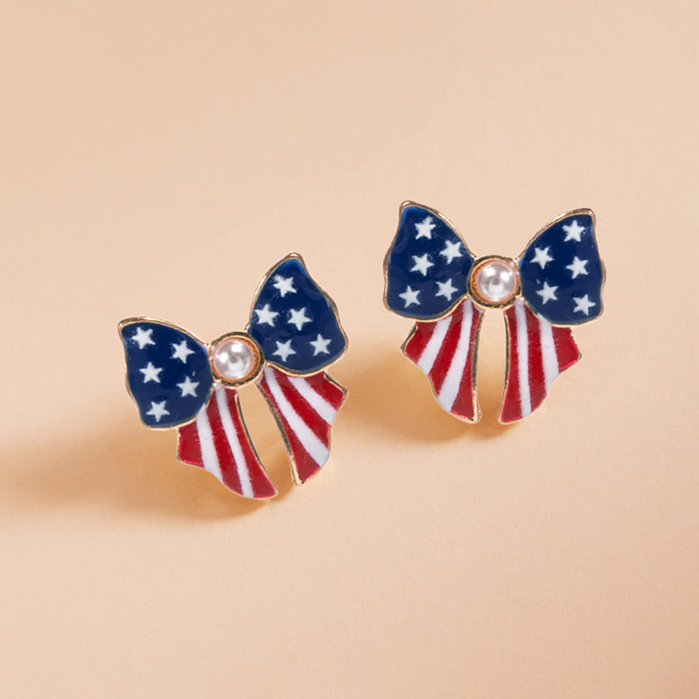 Bow-shaped earrings with American flag design on a beige background