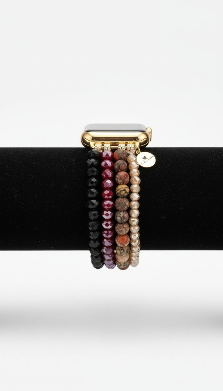 Apple Watch compatible beaded bracelet strap on a black stand with a white background