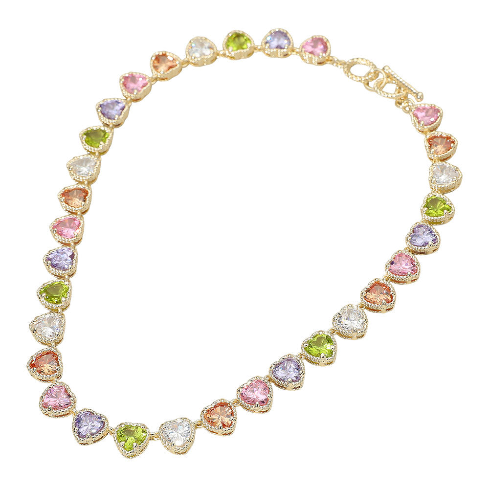 Necklace with multicolored heart shaped gemstones on a white background