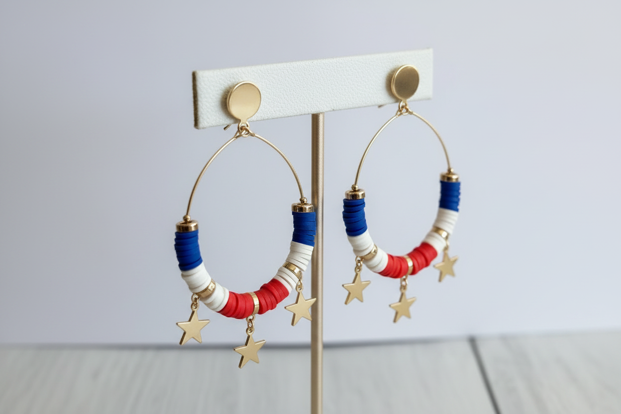 Triple Metal Star Charms Accented Dangle Beaded Disc Hoop Earrings displayed on an earring display bar with a white background. 