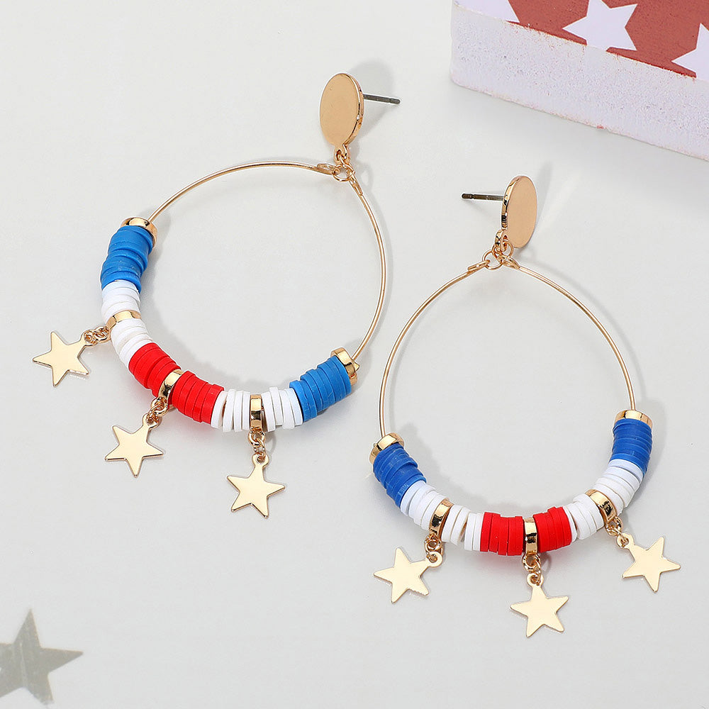 Hoop earrings with star and bead details on a light gray background