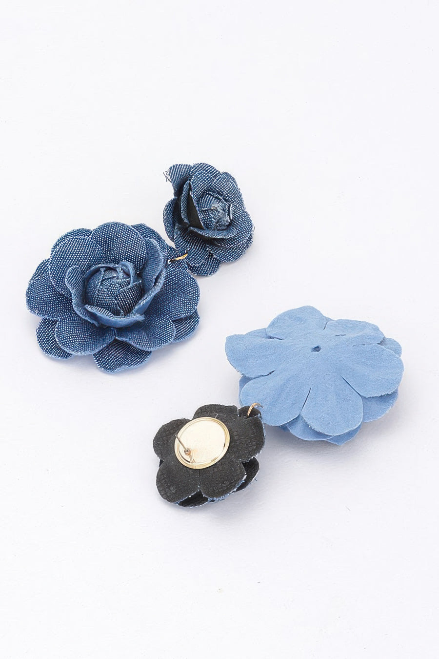 Set of denim floral earrings in blue and black on a white background. Shows front and back 