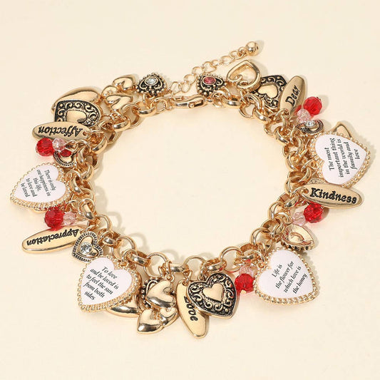 Gold-tone charm bracelet with heart-shaped pendants engraved with inspirational quotes, accented by red and clear beads; also available in silver-tone; 8" length with 2" extender.